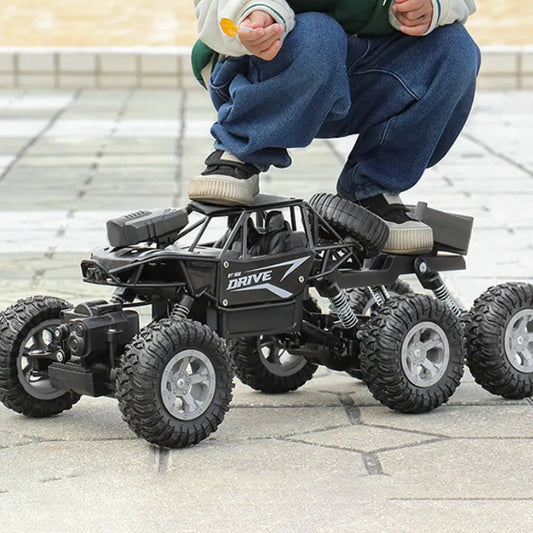 1: 18 Six Wheel Drive RC CAR Cross-country Climbing Spray Racing Car Remote Control Electric Car Fall Resistant Boy Toy Gift